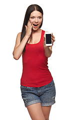 Image showing Excited surprised woman showing cell phone