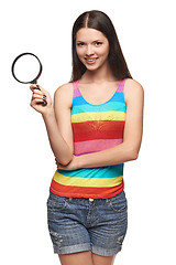 Image showing Woman with magnifying glass over white background