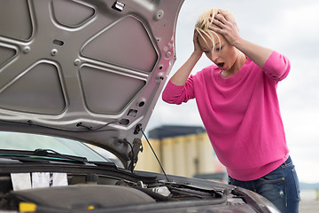 Image showing Stressed Young Woman with Car Defect.