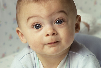 Image showing Baby with wide eyes looking directly to camera