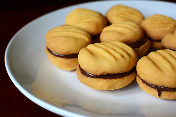 Image showing Plate of cookies with chocolate hazelnut filling