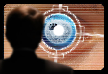 Image showing Man viewing a retinal eye scan on a video monitor