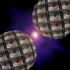 Image showing Two sphere of video screens showing multi-colored eyes