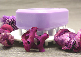 Image showing Lilac soap with decoration articles on a  gray background