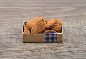 Image showing Almonds on wood