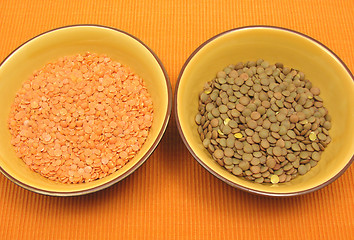 Image showing Two bowls of ceramic with lentils and red lentils