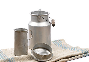 Image showing Graduated jug and milk can