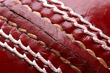 Image showing Close up shot of a red cricket ball