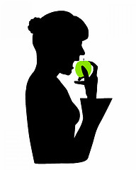 Image showing Woman eating a green apple