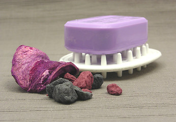 Image showing Lilac soap with decoration articles on a  gray background
