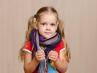 Image showing Girl with a sore throat in warm scarf