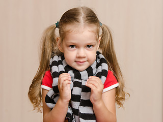 Image showing The three-year girl in a diseased warm scarf