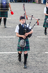 Image showing ULLAPOOL, SCOTLAND - JULY 17: Bagpipes' parade at local Highland