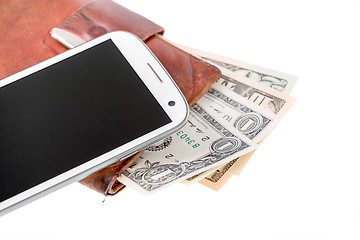 Image showing cellphone and money on white