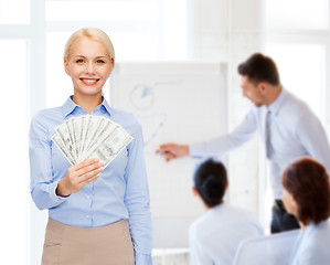 Image showing young businesswoman with dollar cash money