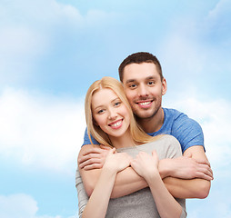 Image showing smiling couple hugging