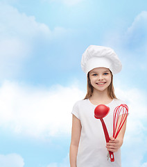 Image showing smiling girl in cook hat with ladle and whisk