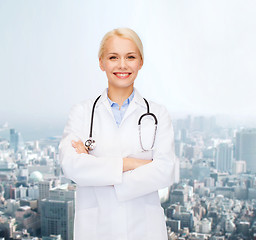 Image showing serious female doctor with stethoscope