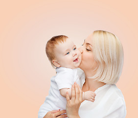 Image showing happy mother kissing smiling baby