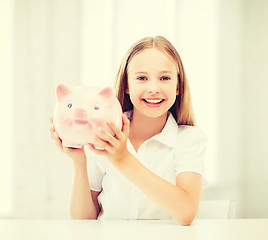 Image showing child with piggy bank