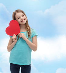 Image showing smiling little girl with red heart