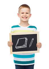 Image showing smiling little boy with blank blackboard