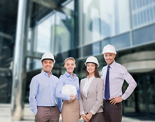 Image showing group of smiling businessmen in white helmets