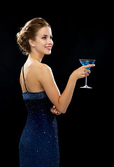 Image showing smiling woman holding cocktail