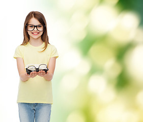 Image showing smiling cute little girl in black eyeglasses