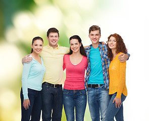 Image showing group of smiling teenagers over green background