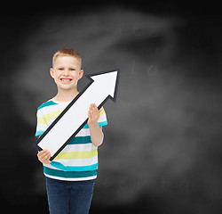 Image showing smiling little boy with blank arrow pointing right