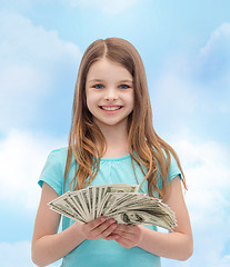 Image showing smiling little girl with dollar cash money