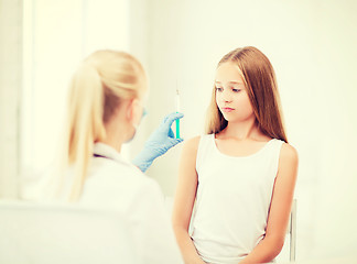 Image showing doctor doing vaccine to child in hospital