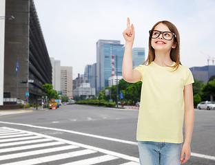 Image showing smiling cute little girl in black eyeglasses