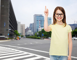 Image showing smiling cute little girl in black eyeglasses