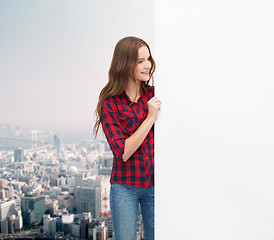 Image showing smiling young teenage girl with white blank board