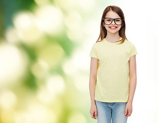 Image showing smiling cute little girl in black eyeglasses