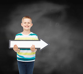 Image showing smiling little boy with blank arrow pointing right