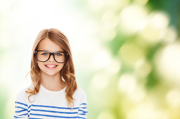 Image showing smiling cute little girl with black eyeglasses