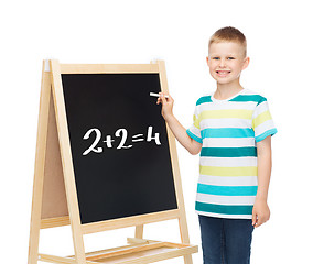 Image showing smiling little boy with blank blackboard