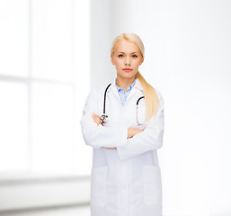 Image showing serious female doctor with stethoscope