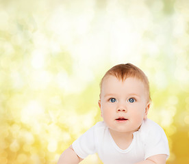 Image showing smiling baby looking up