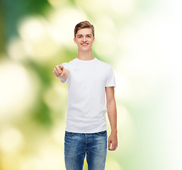 Image showing smiling young man in blank white t-shirt