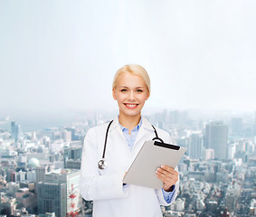 Image showing female doctor with stethoscope and tablet pc