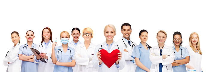 Image showing smiling doctors and nurses with red heart