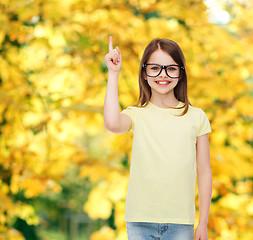 Image showing smiling cute little girl in black eyeglasses