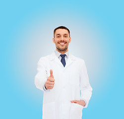 Image showing smiling male doctor showing thumbs up