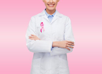 Image showing close up of doctor with cancer awareness ribbon