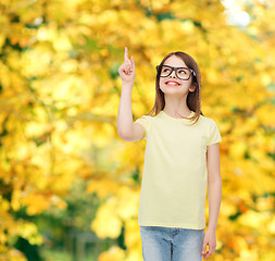 Image showing smiling cute little girl in black eyeglasses