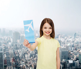 Image showing smiling little girl with airplane ticket